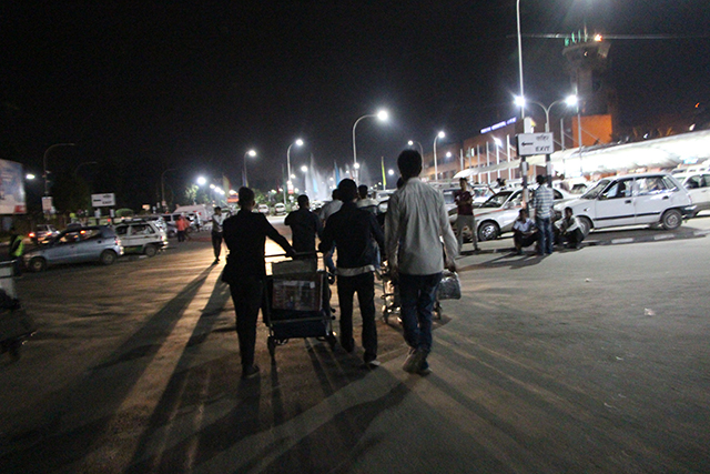 Undocumented workers arrive in Kathmandu (left) where they will be staying for a couple of nights before they go home to Panchthar. They are banned from Malaysia for five years, but have no intention of going back.